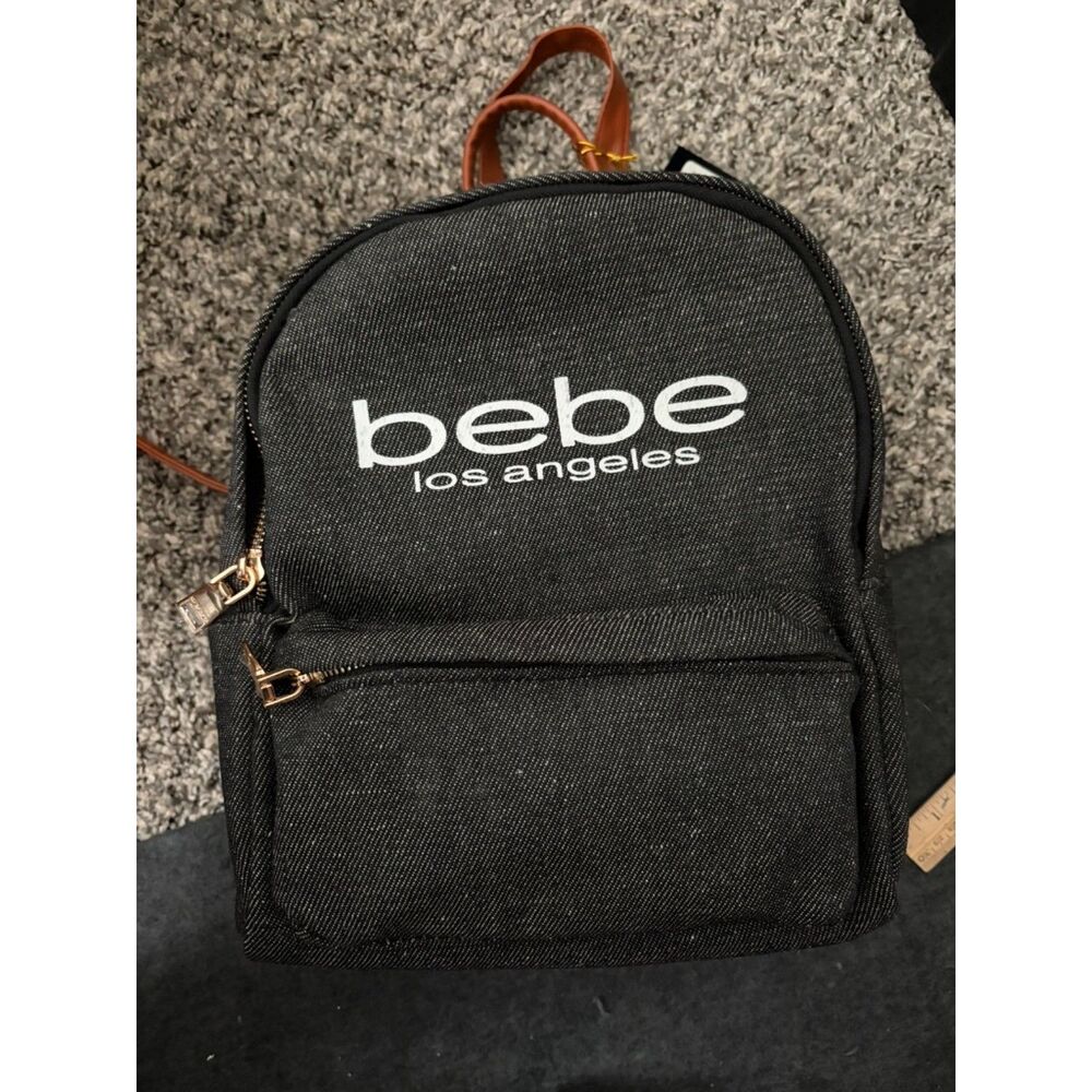Bebe Dark Jean and faux leather backpack NEW